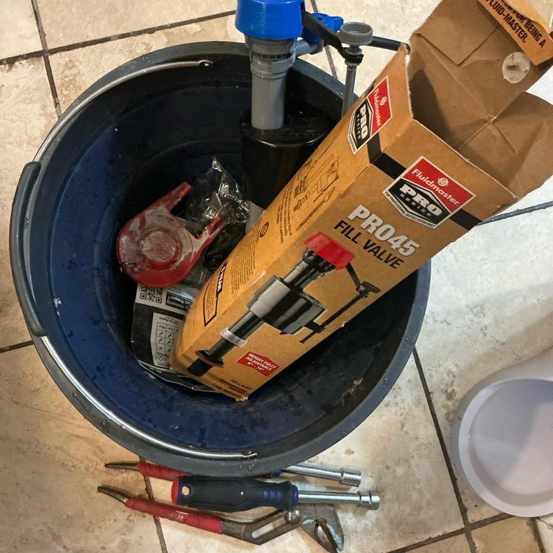 Fill valve and flapper parts in bucket with tools