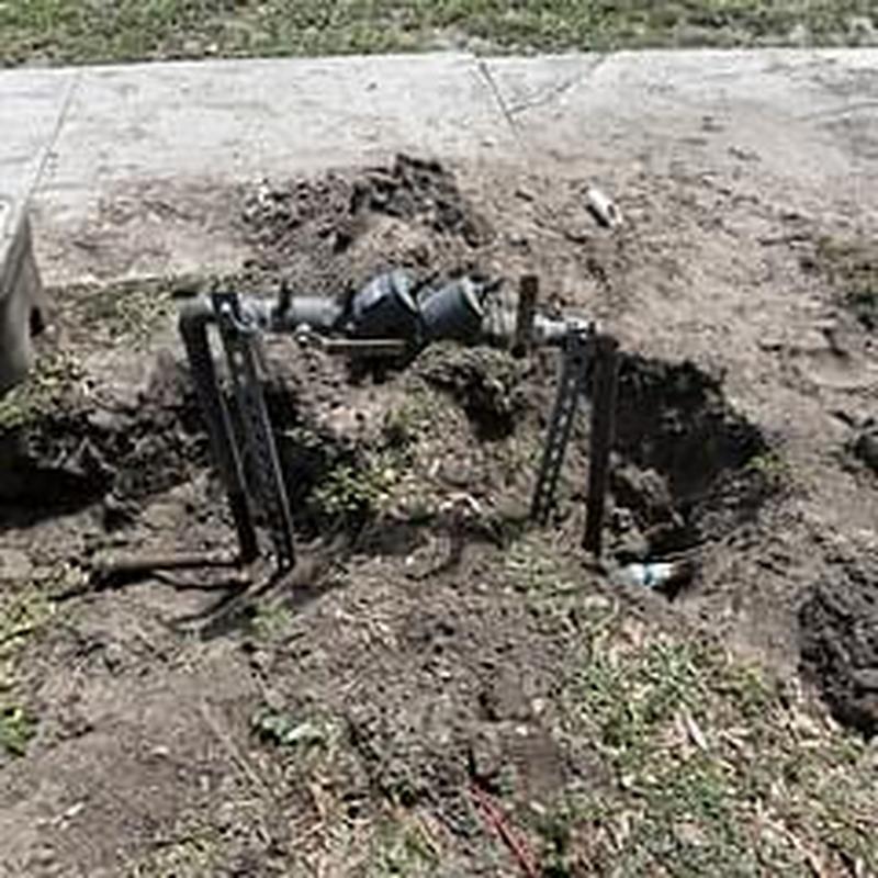 Backflow prevention device with exposed piping outdoors
