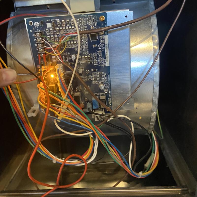 Furnace control board with wiring and glowing fuse light