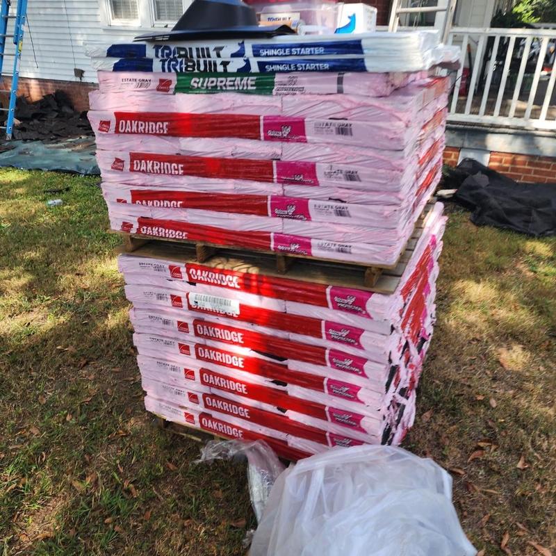 Oak Ridge Owens Corning shingles stacked outdoors Oak Ridge Owens Corning shingles stacked outdoors
