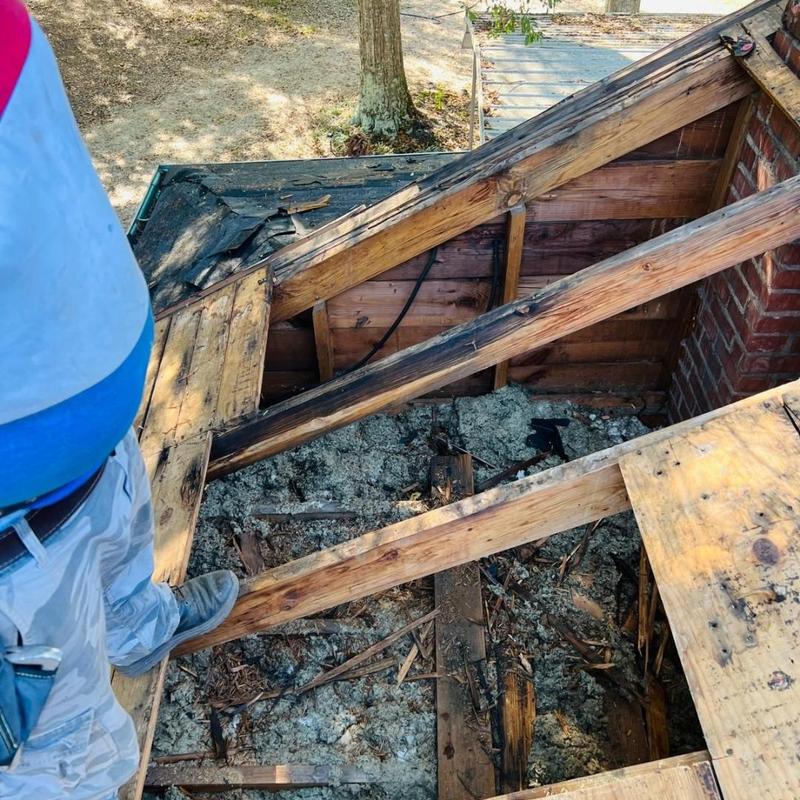 Roof decking with damaged wood and insulation removed Roof decking with damaged wood and insulation removed