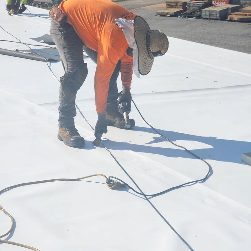 TPO roofing system installation with heat welding tool TPO roofing system installation with heat welding tool