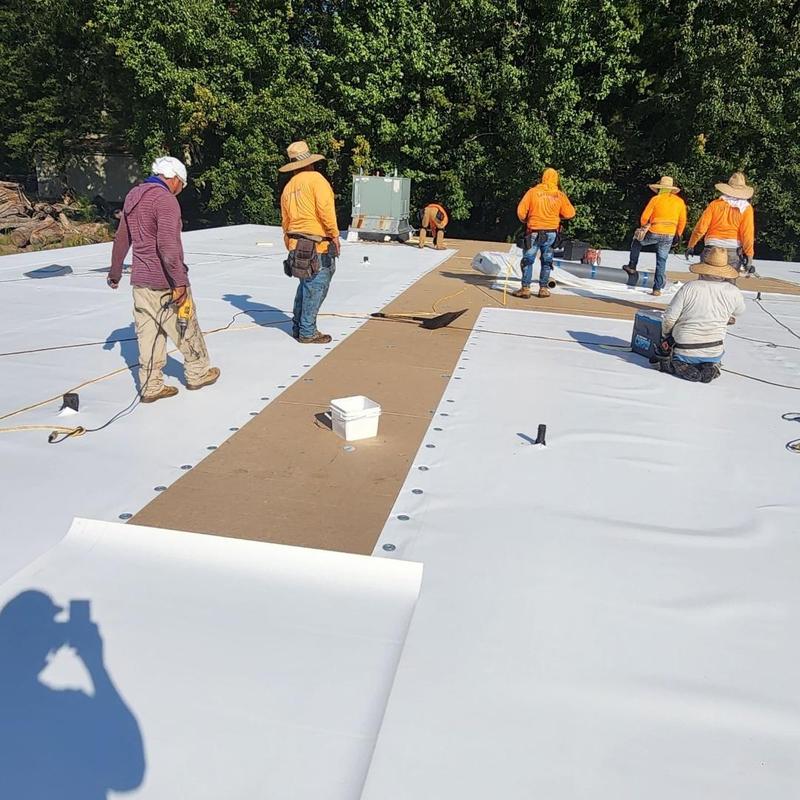 TPO roofing system installation with insulation panels TPO roofing system installation with insulation panels