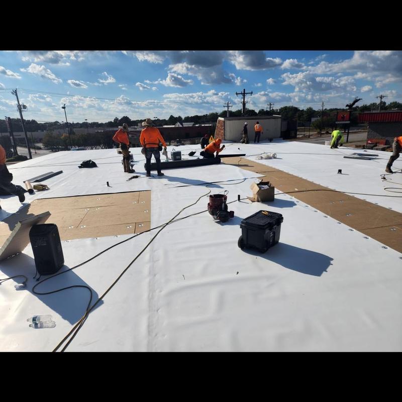 TPO roofing system installation on commercial roof TPO roofing system installation on commercial roof