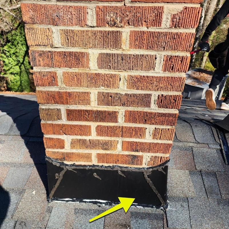 Chimney flashing repair on residential roof in South Carolina Chimney flashing repair on residential roof in South Carolina