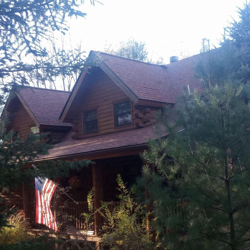Log cabin roof with new asphalt shingles in Lehighton PA Log cabin roof with new asphalt shingles in Lehighton PA