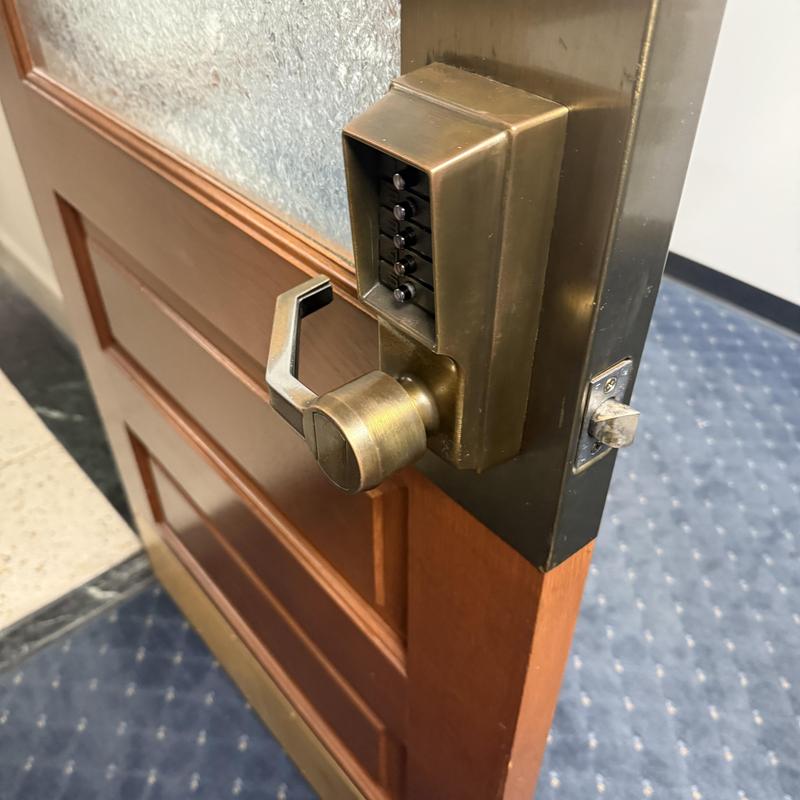 Access control keypad with brass door lever lock