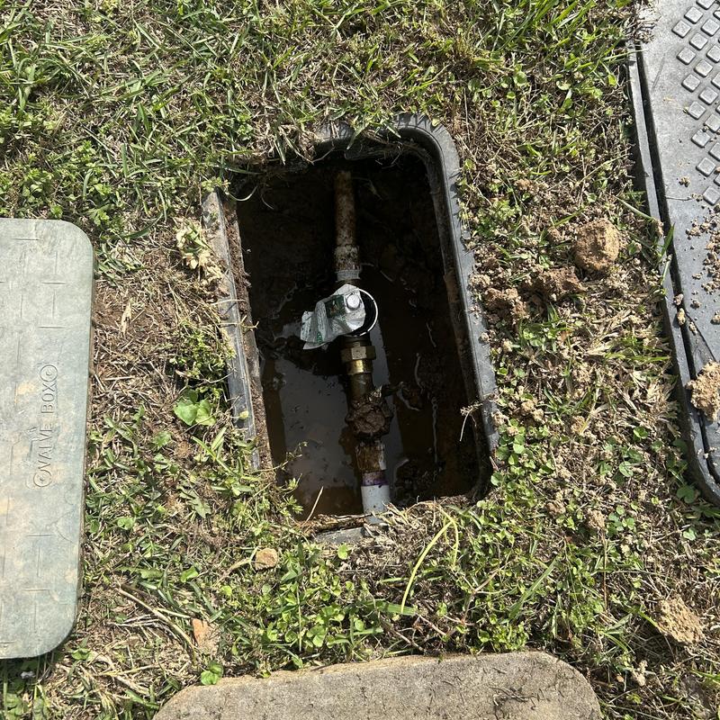 Water pressure regulator in ground box replacement in yard Water pressure regulator in ground box replacement in yard