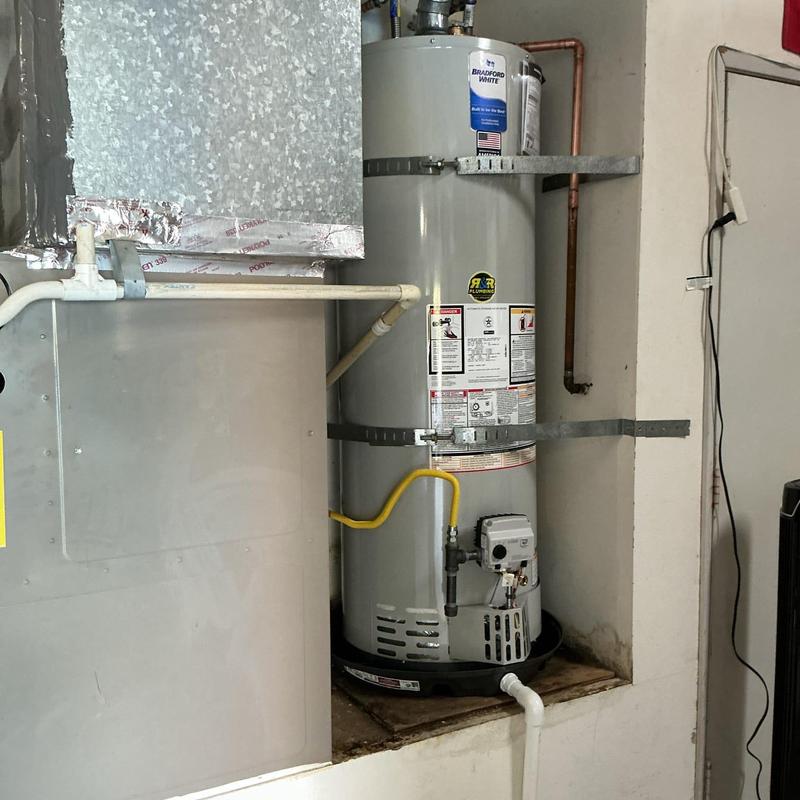 Water heater with new catch pan installation