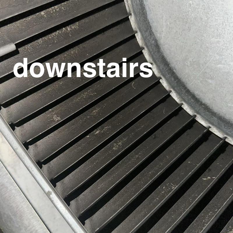 Downstairs HVAC blower wheel with black soot buildup
