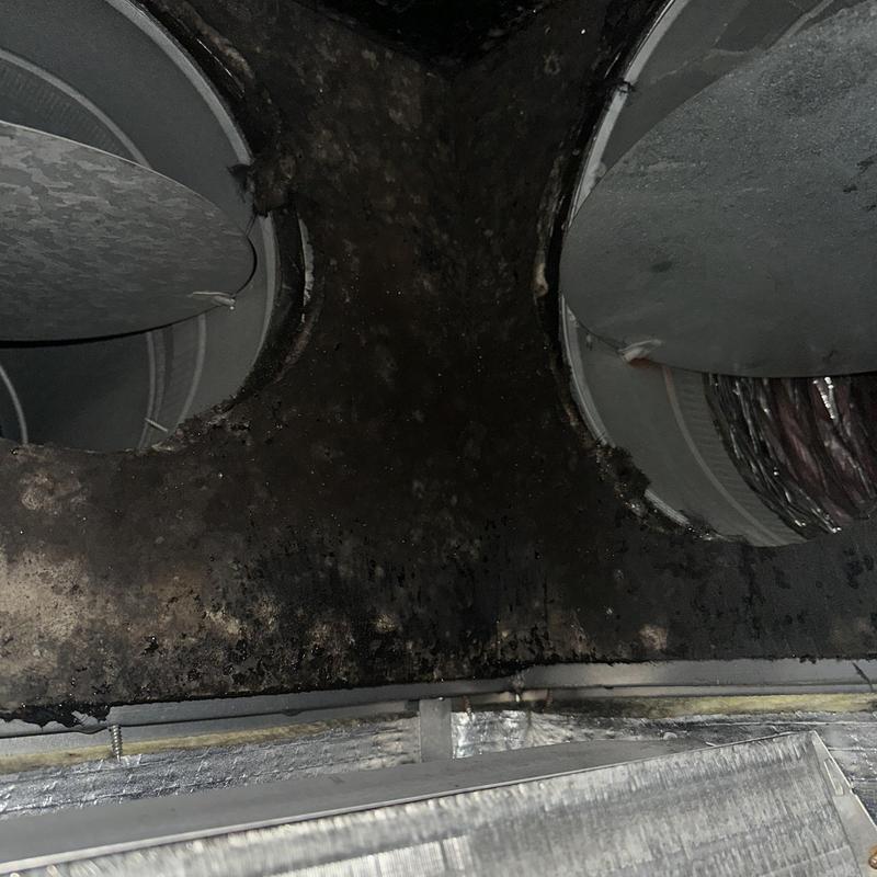 HVAC return plenum heavily contaminated with black soot