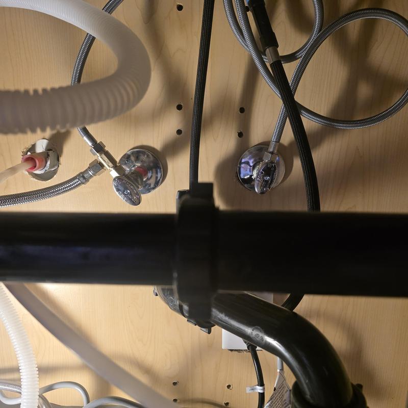 Angle stop valves and water supply lines under sink
