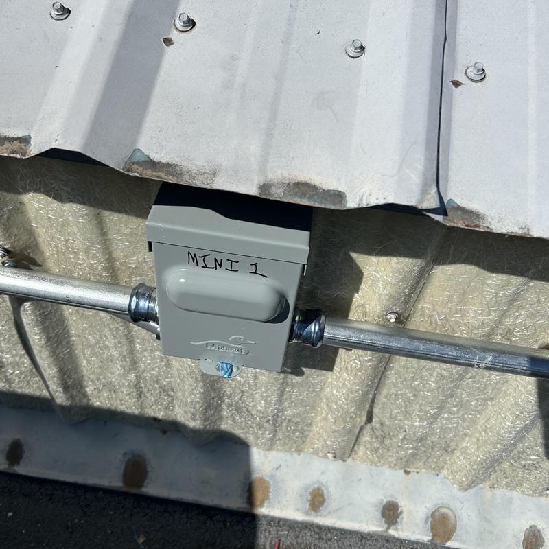 Commercial mini split wiring junction box on metal wall