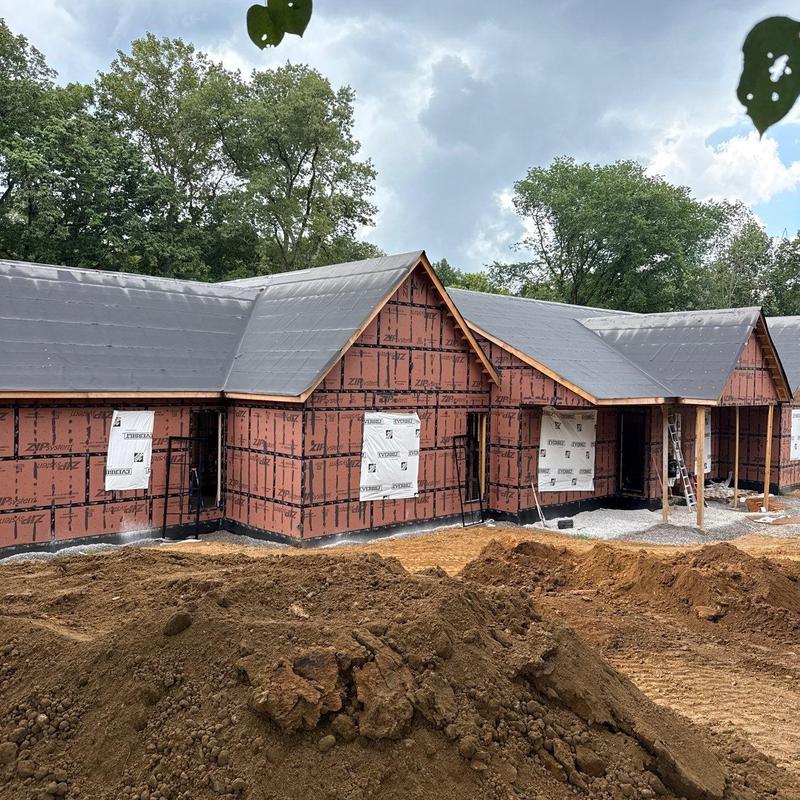 Roof underlayment installation on residential construction site