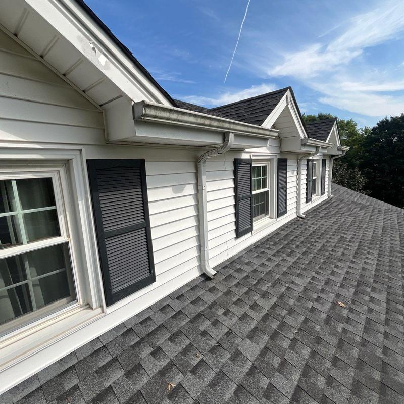 Asphalt shingle roof with gutters and flashing inspection