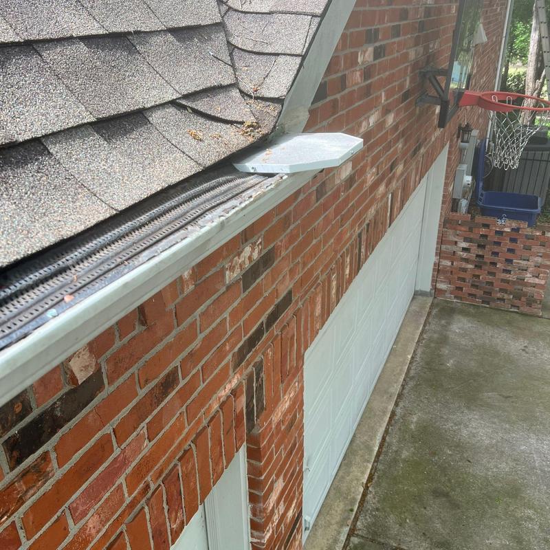 Xtreme stainless steel mesh gutter miters on brick home