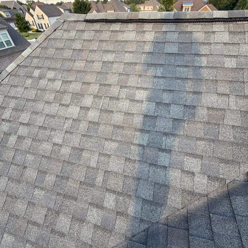 Asphalt shingle roof with hail damage and flashing issues