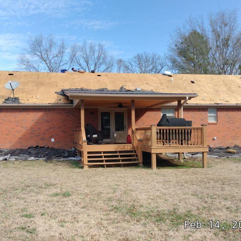 Asphalt roofing tear off on brick home roof