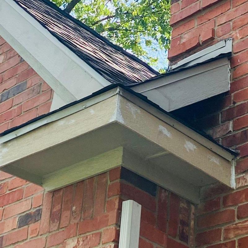 LP Smartside fascia board installation on brick roof edge