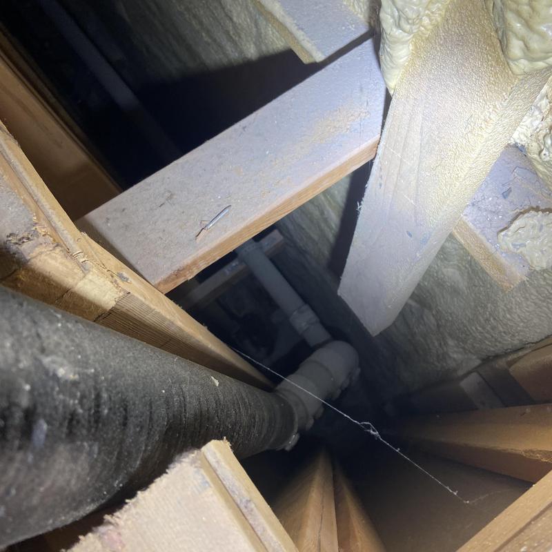 Cast-iron vent pipe with improper bracing in ceiling cavity
