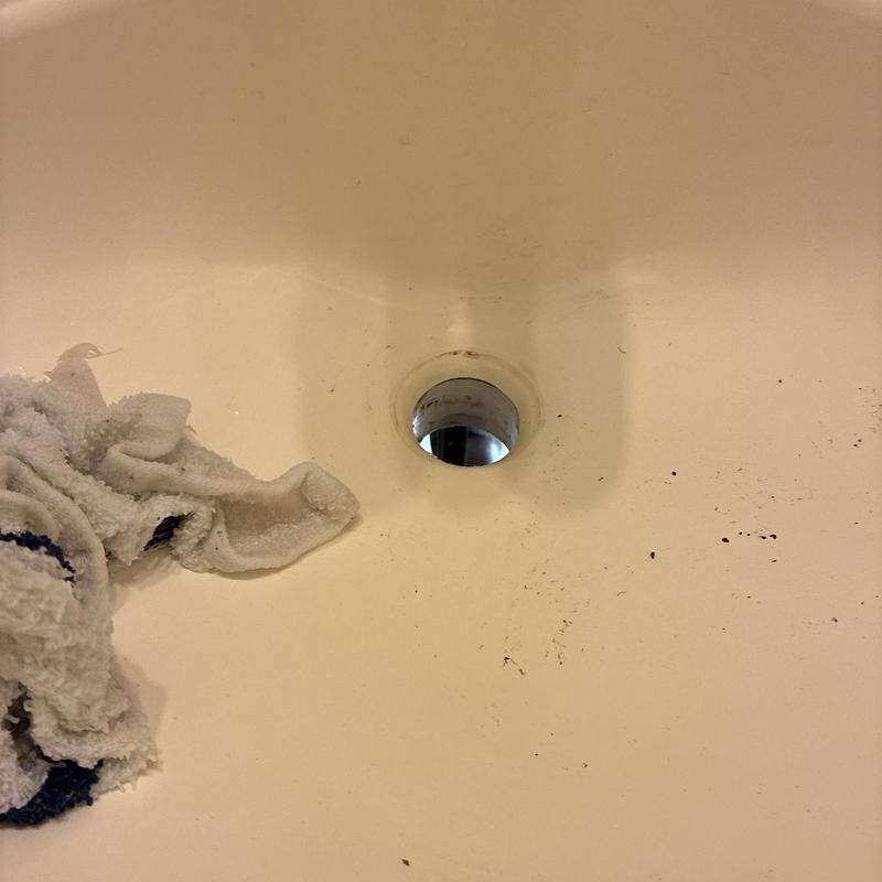 Bathroom sink drain hole with missing pop-up assembly
