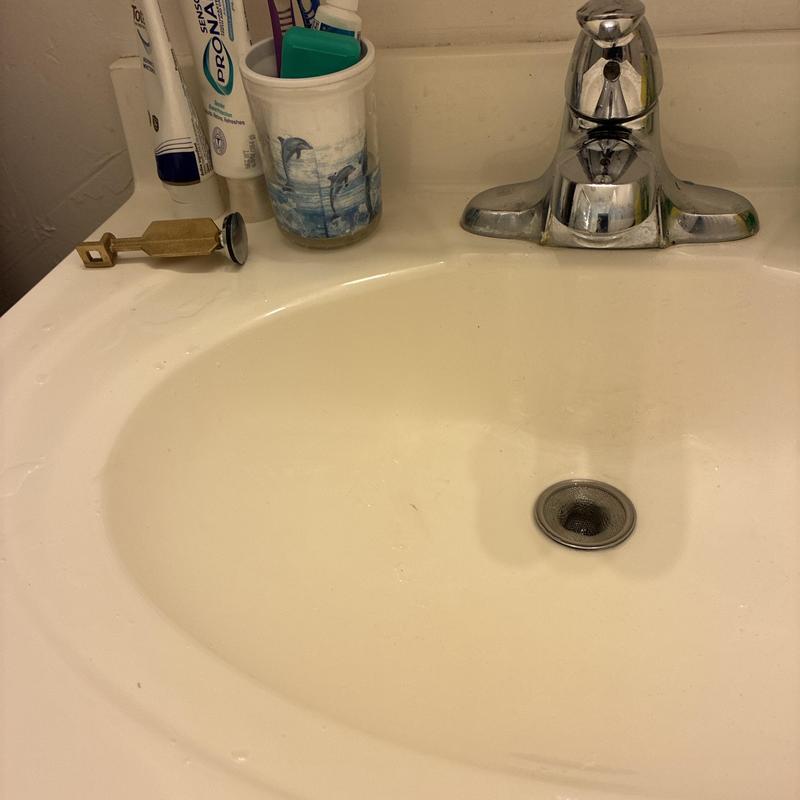 Bathroom sink pop-up drain assembly and faucet
