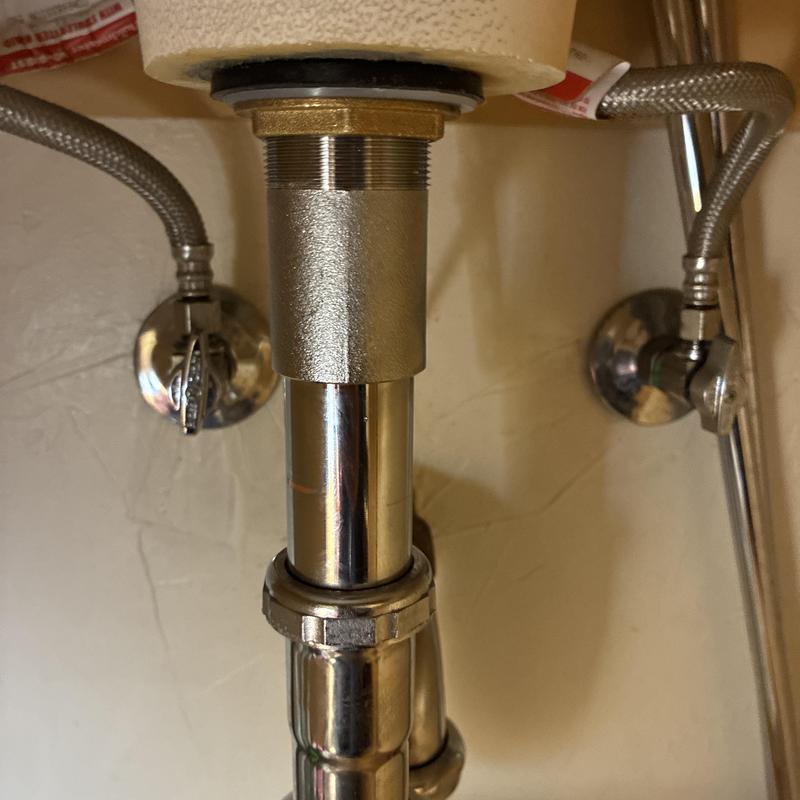 Pop-up drain assembly under bathroom sink repair