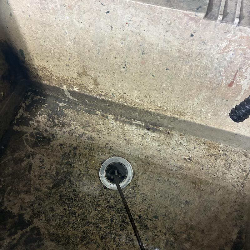 Utility sink drain cabling clearing debris in San Francisco