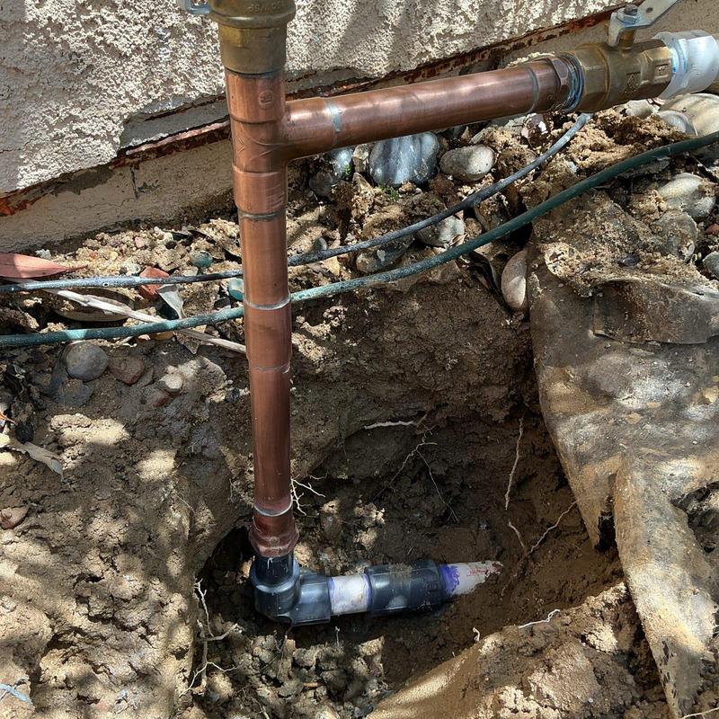 Copper main water line with 90-degree fitting installation