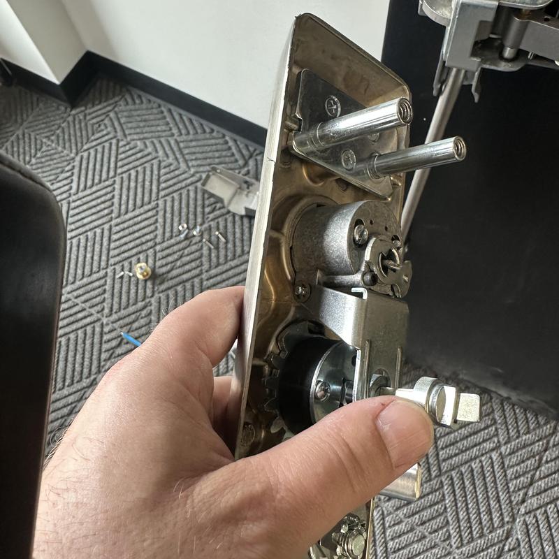 Commercial door mortise lock mechanism held by hand
