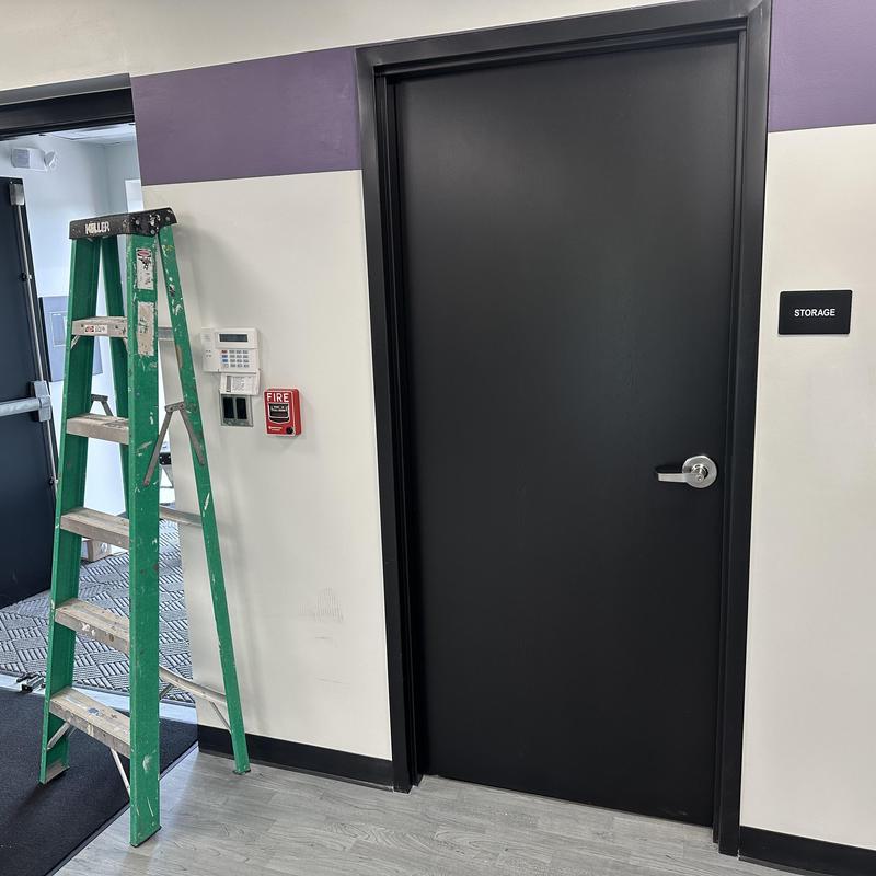 Commercial storage door with lock and lever handle