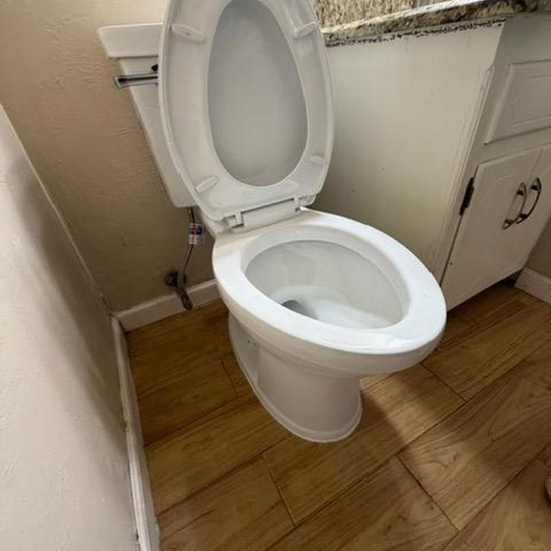 Kohler toilet installation in bathroom corner