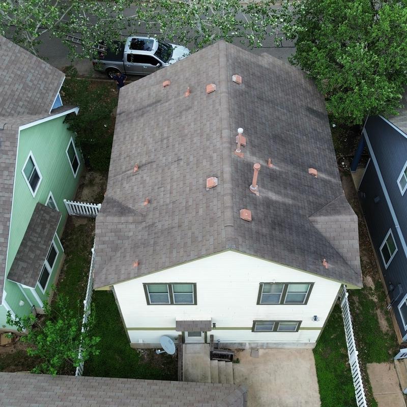 Asphalt shingle roof with exposed fasteners needing caulk