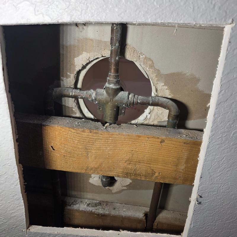 Tub shower valve plumbing inside wall cutout
