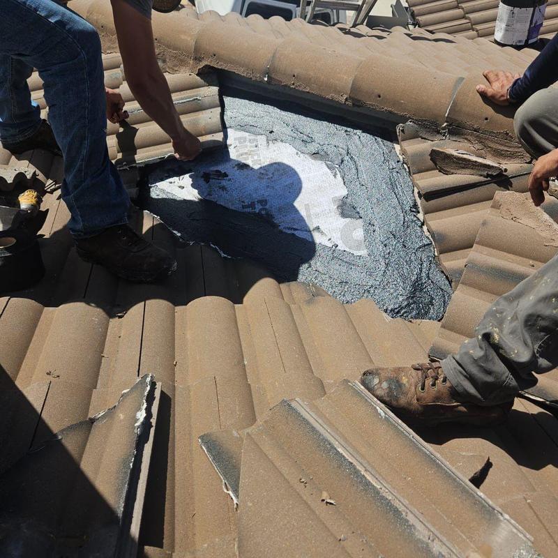Concrete tile roof leak repair with underlayment exposed