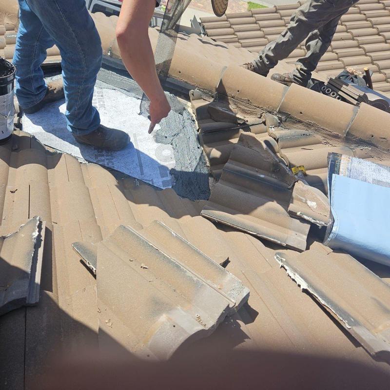 Concrete tile roof leak patching with underlayment repair