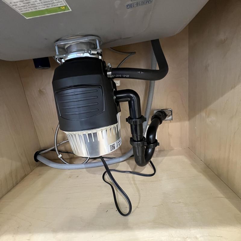 Garbage disposal and under-sink plumbing installation