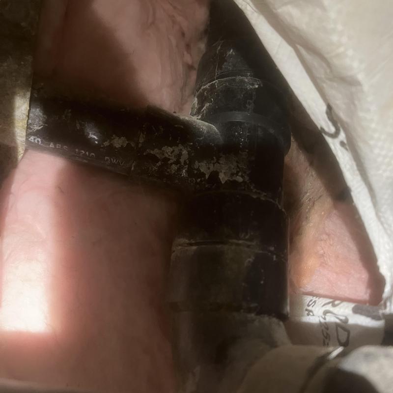 Kitchen sink drain line with black PVC piping