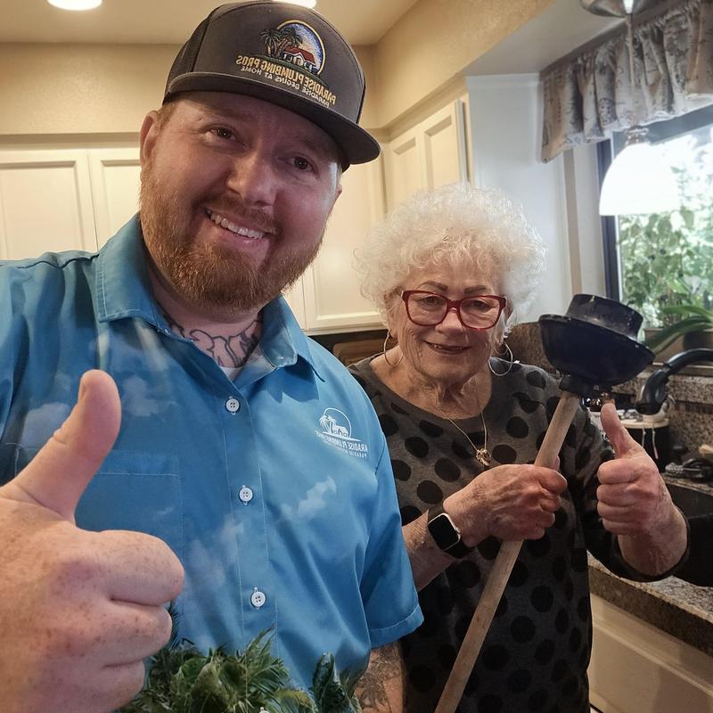 Kitchen sink drain with plunger and customer thumbs up