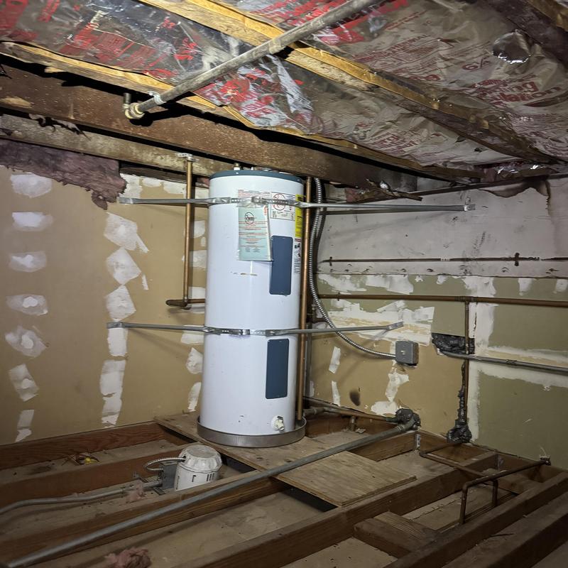 Electric water heater with earthquake strapping installation