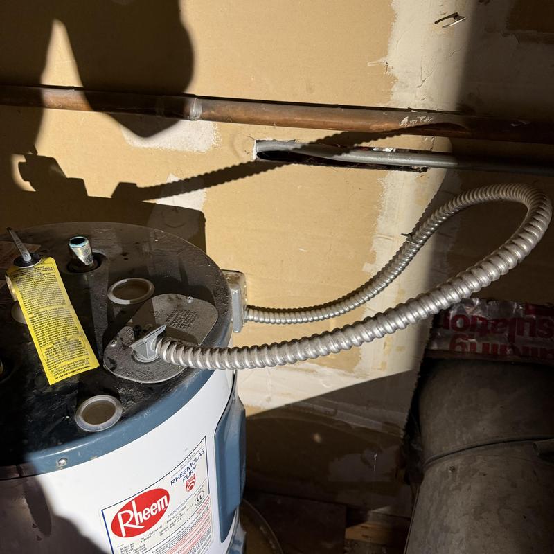 Electric water heater installation with flexible conduit