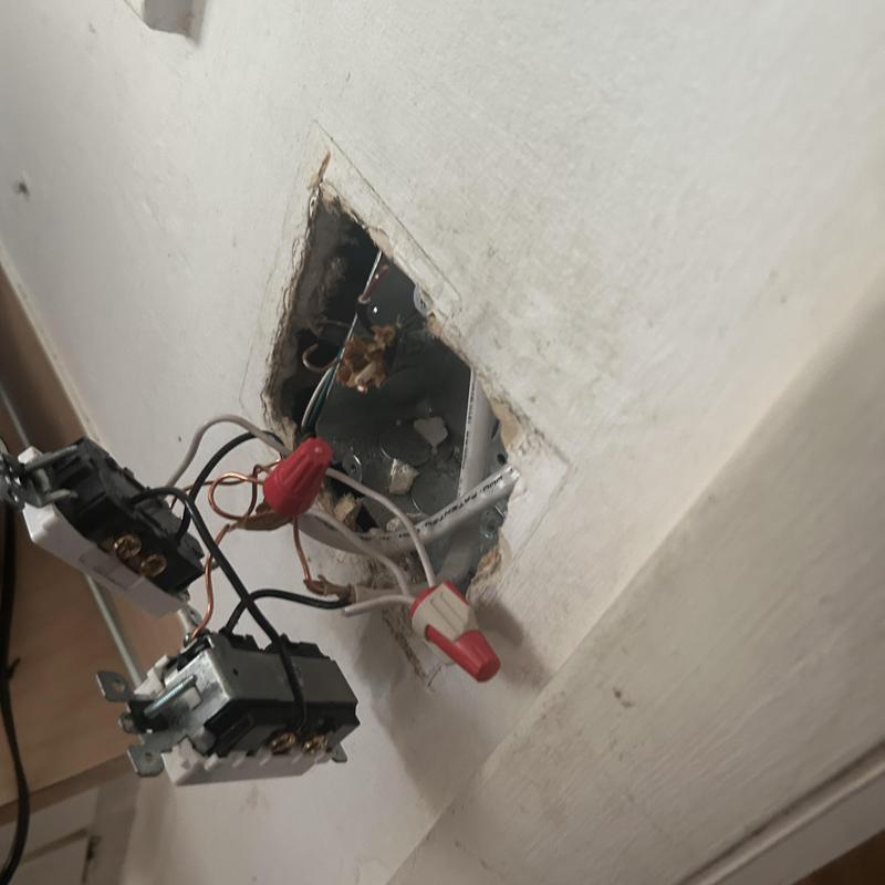 Electrical outlet wiring repair with wire connectors in wall