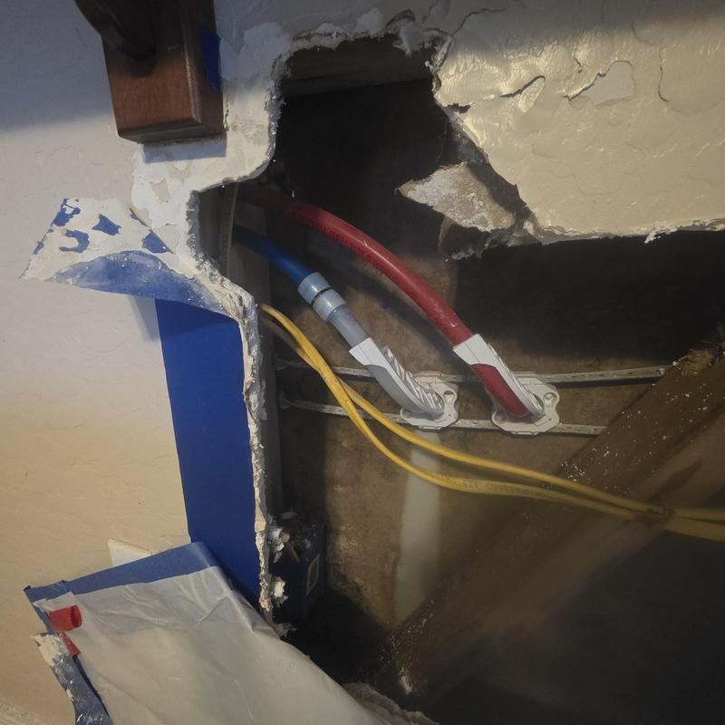 Cold water PEX pipe inside kitchen wall cavity