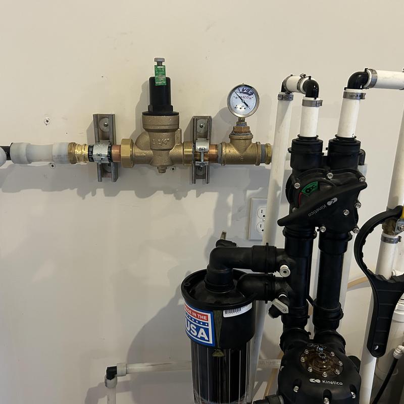 Pressure reducing valve with pressure gauge and piping