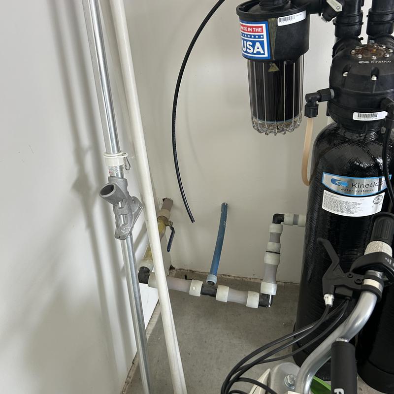 Water filtration system with Kinetico tank and filter housing
