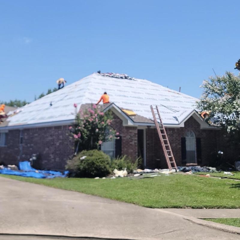 Synthetic roof underlayment installation on residential roof