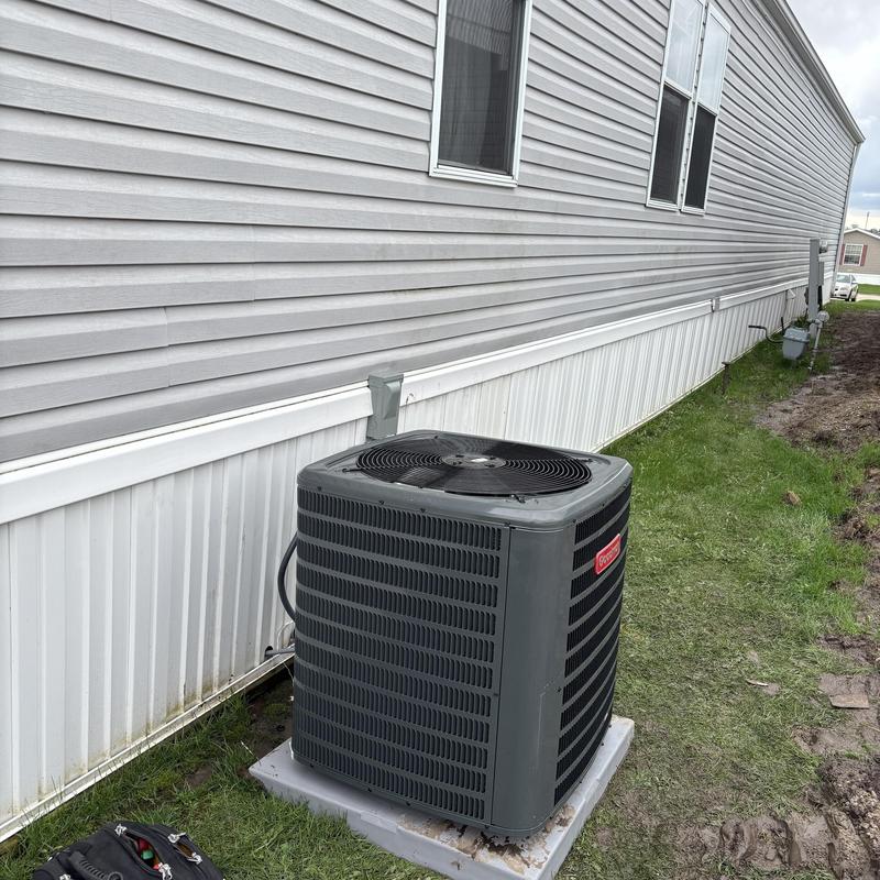 High efficiency central air conditioner outside home