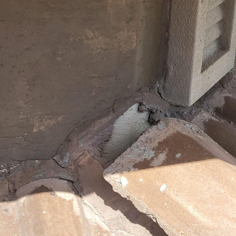 Concrete tile roof mortar cracking and deterioration close-up
