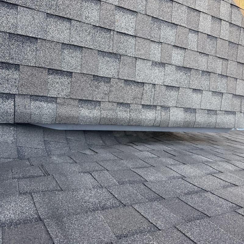 Asphalt shingle roof with hail damage and granule loss