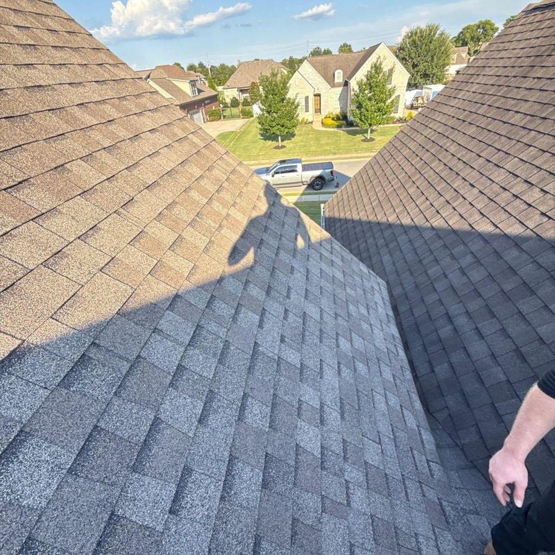 Asphalt shingle roof with hail damage inspection
